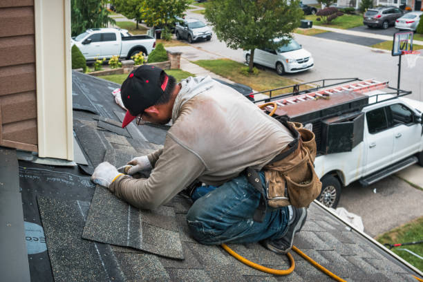 Professional Roof Replacement technician working in Liberty Center, IA